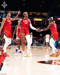As a team, The Aces celebrate a huge shot by A'ja Wilson.